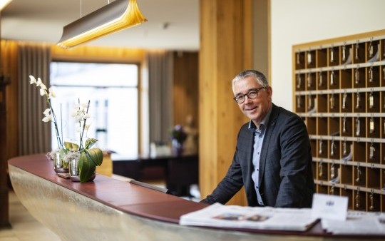 Reception manager Jürgen Winkelmann at the reception in the Hotel Jagdhaus Wiese in the Sauerland