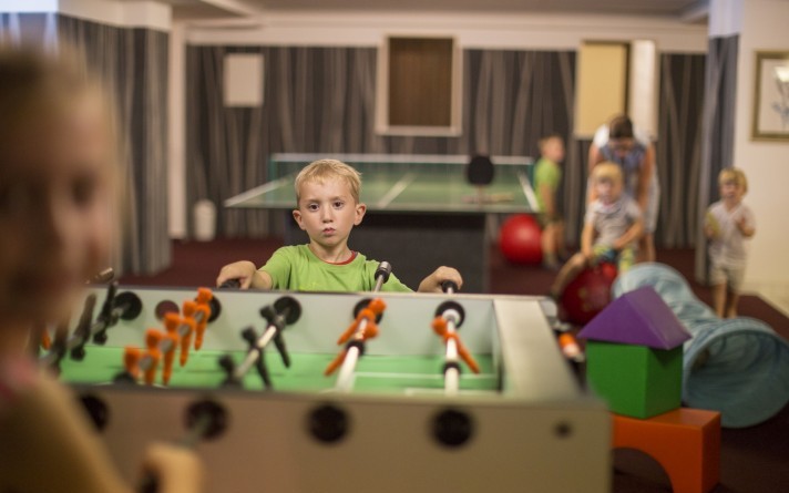 Fun and games at the table football table in the children's playroom at the Jagdhaus Wiese family hotel in the Sauerland