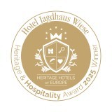 Gewinnerlogo Heritage & Hospitality-Award 2025 der Heritage Hotels of Europe