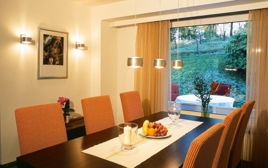 Dining room with terrace of the ‘Swallow's Nest’ holiday flat in the Schneisberghaus belonging to the Hotel Jagdhaus Wiese in the Sauerland region